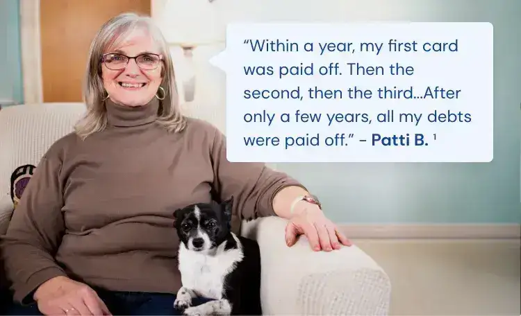 woman with long brown hair smiling because she has found debt relief